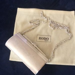 Rodo Italian silver tone hard case clutch